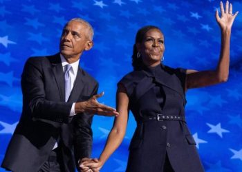 Barack and Michelle Obama electrify Democrats but warn of tight race