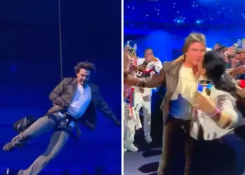 Tom Cruise abseils off stadium roof in daring Olympic finale