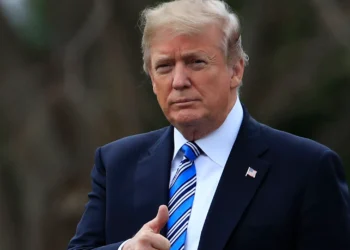 Trump rushed to safety and suspect held after man spotted with rifle